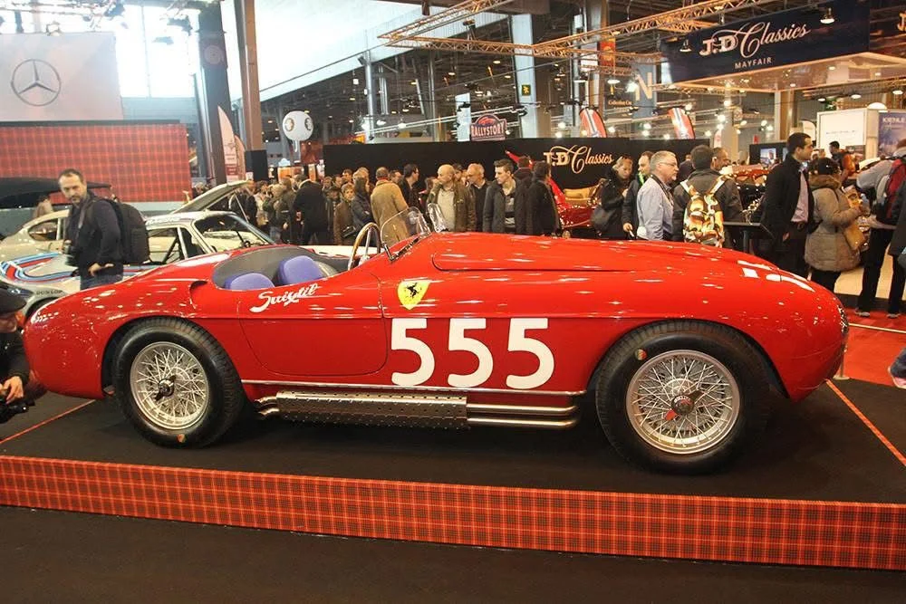 Historic Ferrari number 555 displayed at a major classic car exhibition