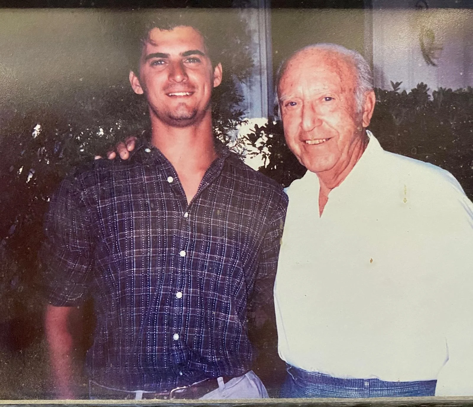 Young Donnie Callaway standing with an older family member